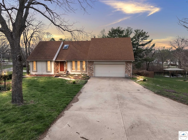 5900 Apple Rd, Sedalia, MO 65301 - single story home with driveway, roof with shingles, a front lawn, and an attached garage