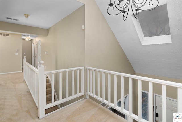 5900 Apple Rd, Sedalia, MO 65301 - staircase with a notable chandelier, a skylight, visible vents, and carpet floors