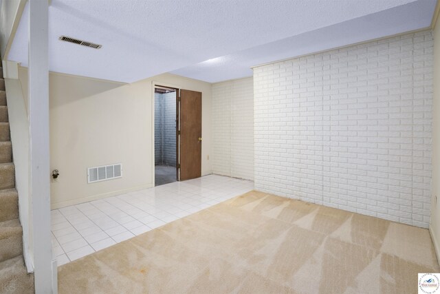 5900 Apple Rd, Sedalia, MO 65301 - tiled spare room with carpet flooring, a textured ceiling, visible vents, and stairway