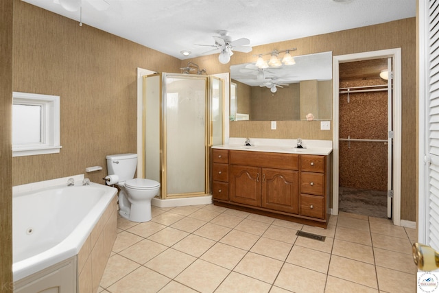 5900 Apple Rd, Sedalia, MO 65301 - bathroom with tile patterned floors, toilet, a ceiling fan, and a stall shower