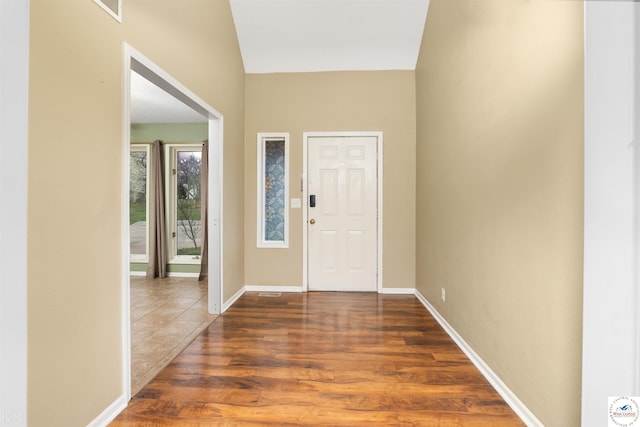 5900 Apple Rd, Sedalia, MO 65301 - entryway with visible vents, wood finished floors, and baseboards