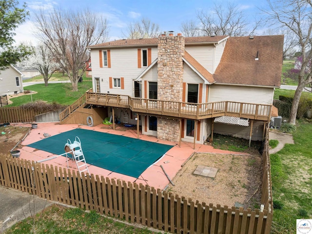 5900 Apple Rd, Sedalia, MO 65301 - view of pool featuring cooling unit, stairs, a patio, a deck, and a fenced backyard