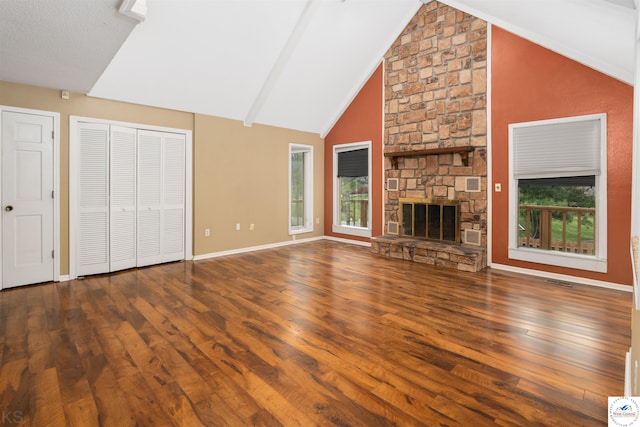 5900 Apple Rd, Sedalia, MO 65301 - unfurnished living room featuring a fireplace, high vaulted ceiling, visible vents, baseboards, and hardwood / wood-style flooring