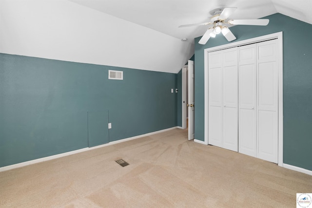 5900 Apple Rd, Sedalia, MO 65301 - unfurnished bedroom with baseboards, visible vents, light colored carpet, and lofted ceiling