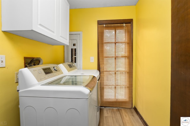 5900 Apple Rd, Sedalia, MO 65301 - clothes washing area featuring cabinet space, washing machine and clothes dryer, and light wood-style flooring