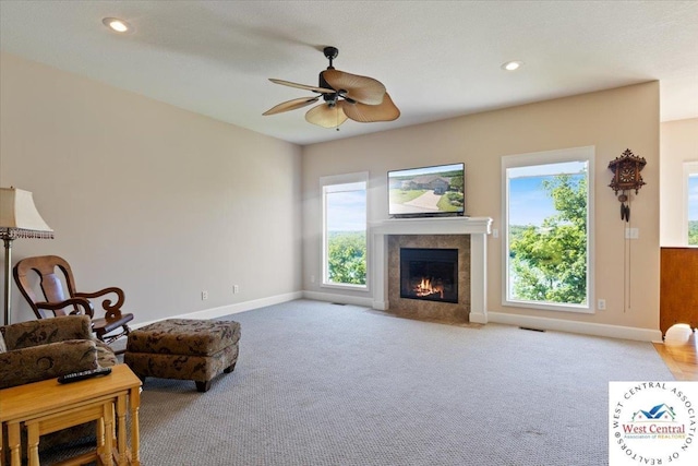 22714 Lake Dr, Warsaw, MO 65355 - living area with plenty of natural light, ceiling fan, a tile fireplace, carpet flooring, and recessed lighting