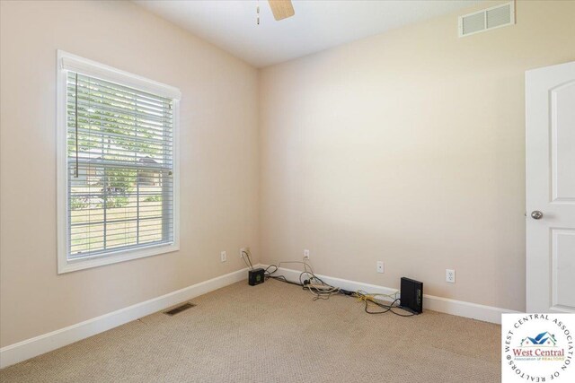 22714 Lake Dr, Warsaw, MO 65355 - carpeted empty room with baseboards and a ceiling fan