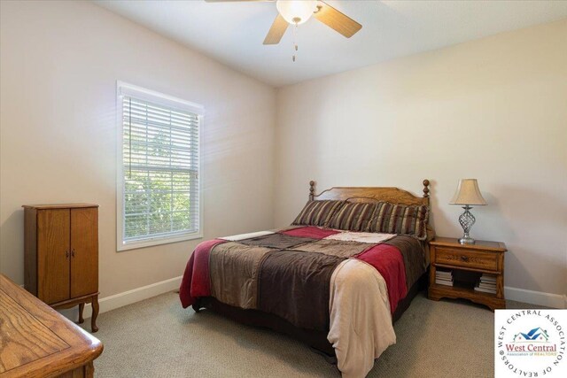 22714 Lake Dr, Warsaw, MO 65355 - bedroom featuring carpet floors and ceiling fan