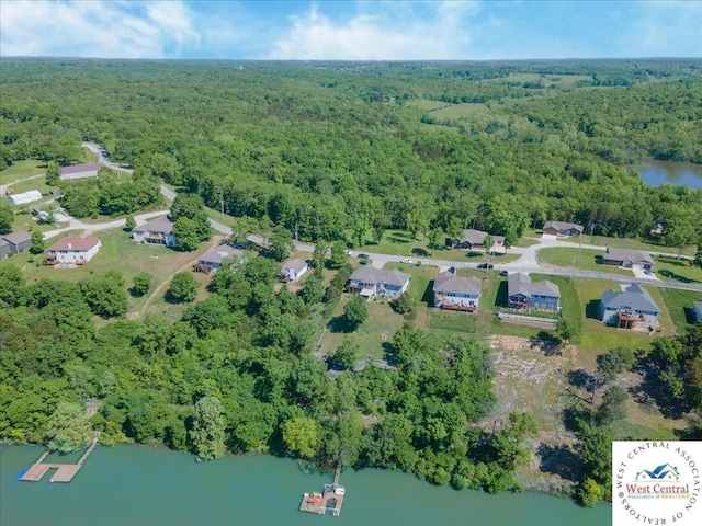 22714 Lake Dr, Warsaw, MO 65355 - aerial view of property's location featuring a heavily wooded area and a large body of water