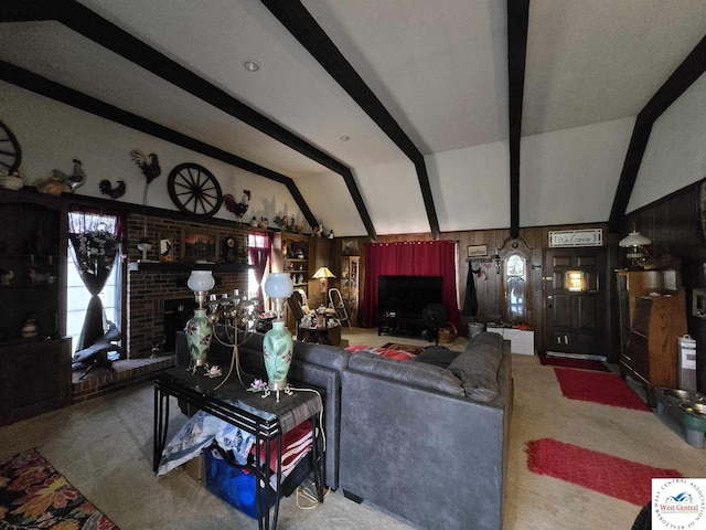 512 N Price Ln, Clinton, MO 64735 - carpeted living area featuring a brick fireplace and lofted ceiling with beams