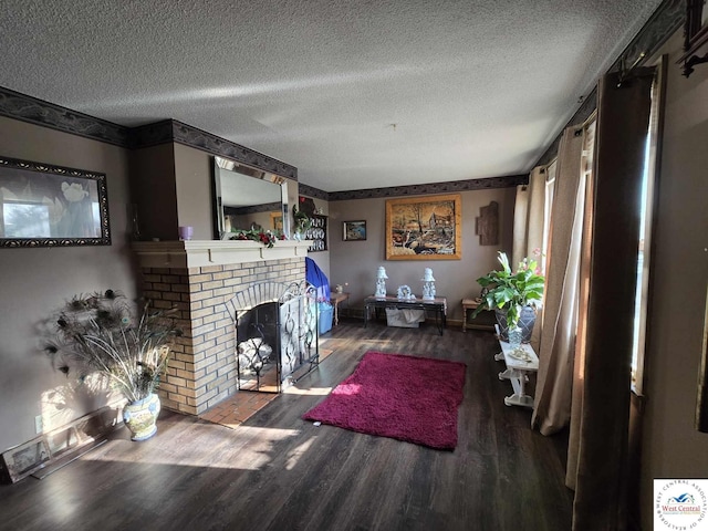 512 N Price Ln, Clinton, MO 64735 - living area with a brick fireplace, a textured ceiling, wood finished floors, and baseboards