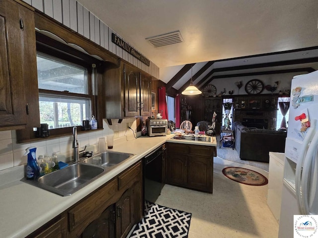 512 N Price Ln, Clinton, MO 64735 - kitchen with decorative backsplash, a sink, visible vents, light countertops, and black appliances
