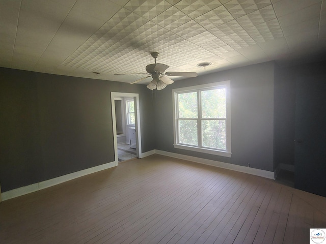 1105 Lay Ave, Warsaw, MO 65355 - unfurnished room with hardwood / wood-style flooring and ceiling fan