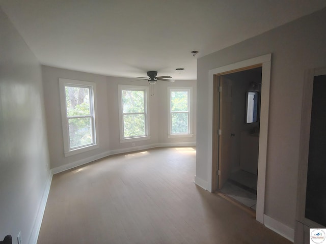 1105 Lay Ave, Warsaw, MO 65355 - empty room with wood finished floors and a ceiling fan