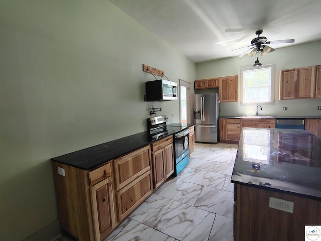 1105 Lay Ave, Warsaw, MO 65355 - kitchen with appliances with stainless steel finishes, light marble finish floors, dark countertops, and ceiling fan