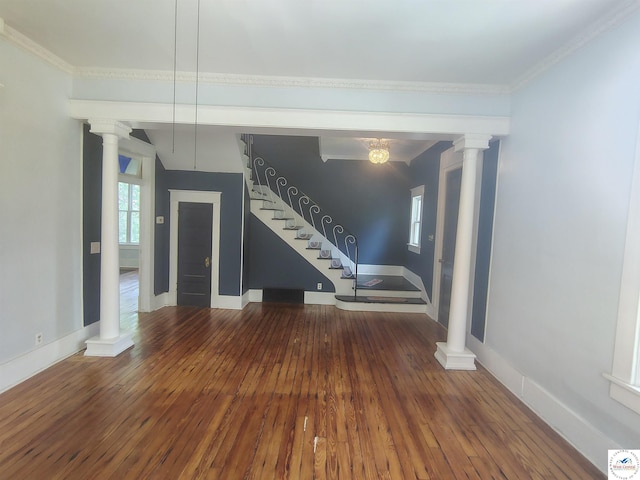 1105 Lay Ave, Warsaw, MO 65355 - unfurnished living room with decorative columns, wood-type flooring, stairway, and crown molding