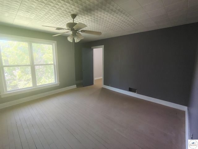 1105 Lay Ave, Warsaw, MO 65355 - unfurnished room with a ceiling fan and wood-type flooring