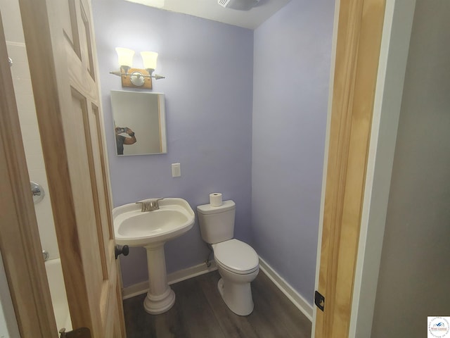 1105 Lay Ave, Warsaw, MO 65355 - bathroom featuring wood finished floors and toilet