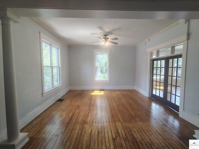 1105 Lay Ave, Warsaw, MO 65355 - empty room with hardwood / wood-style floors, healthy amount of natural light, ceiling fan, ornate columns, and ornamental molding