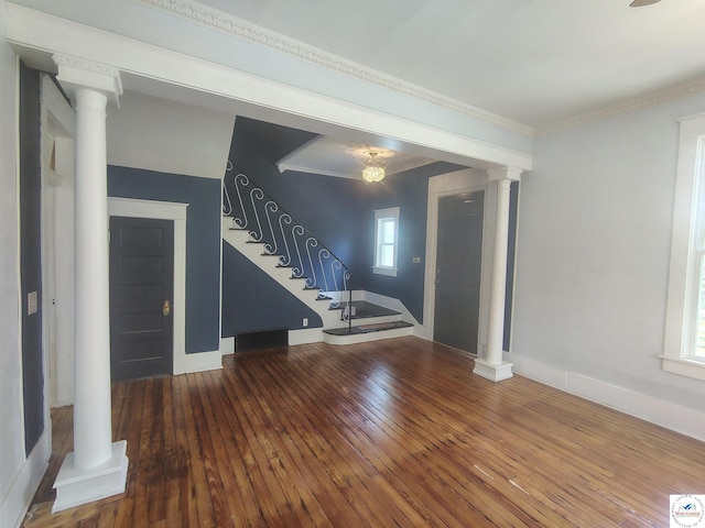 1105 Lay Ave, Warsaw, MO 65355 - entrance foyer featuring decorative columns, wood-type flooring, stairway, healthy amount of natural light, and ornamental molding