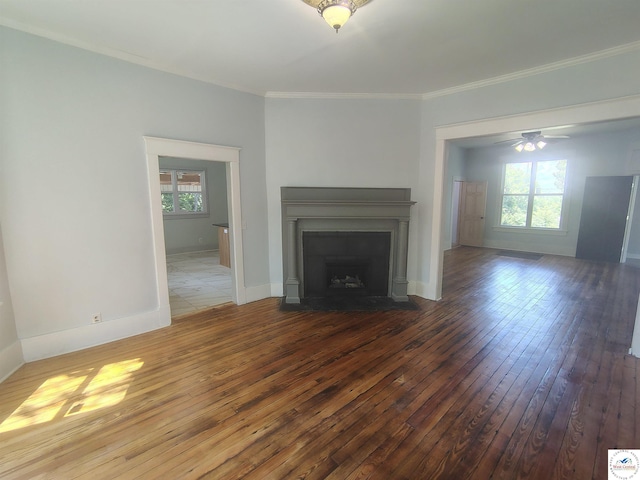 1105 Lay Ave, Warsaw, MO 65355 - unfurnished living room featuring wood-type flooring, plenty of natural light, a fireplace with flush hearth, ornamental molding, and a ceiling fan