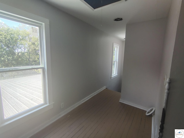 1105 Lay Ave, Warsaw, MO 65355 - spare room featuring attic access and hardwood / wood-style floors
