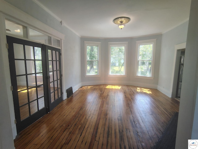 1105 Lay Ave, Warsaw, MO 65355 - empty room with french doors, hardwood / wood-style floors, and ornamental molding