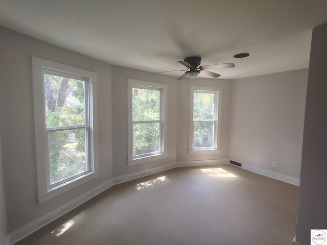 1105 Lay Ave, Warsaw, MO 65355 - unfurnished room featuring a ceiling fan and wood finished floors
