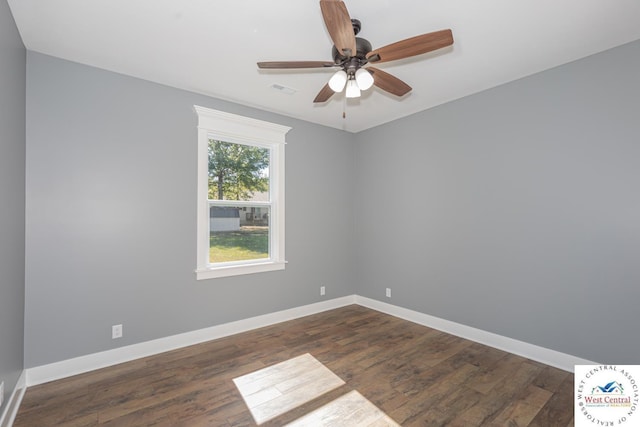 unfurnished room with visible vents, ceiling fan, baseboards, and dark wood finished floors