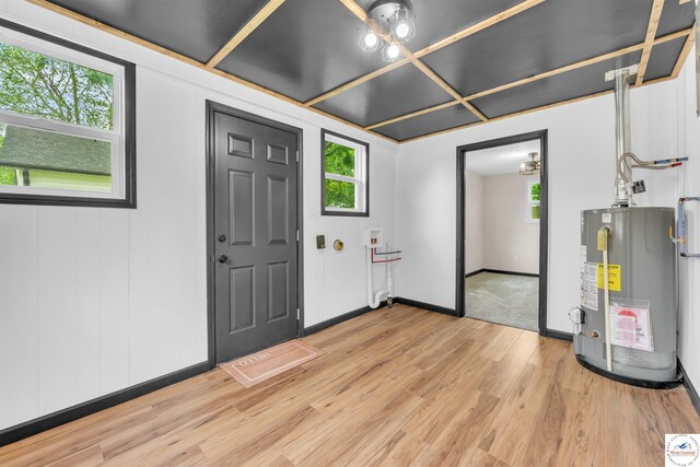 1401 S Park Ave, Sedalia, MO 65301 - entryway featuring water heater, plenty of natural light, light wood-style flooring, and baseboards