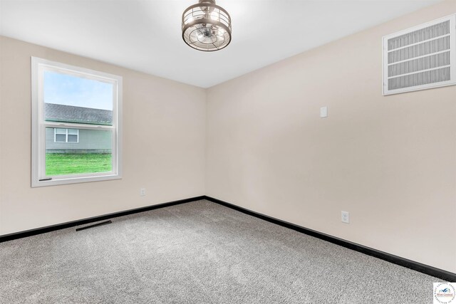 1401 S Park Ave, Sedalia, MO 65301 - carpeted empty room with baseboards