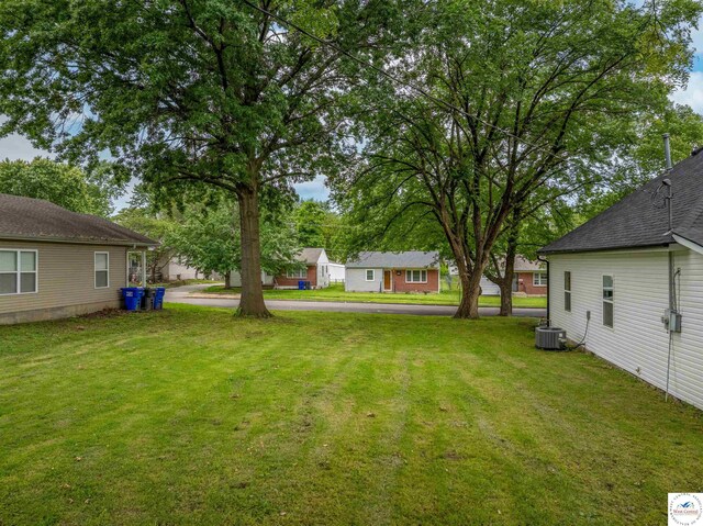 1401 S Park Ave, Sedalia, MO 65301 - view of grassy yard with central AC unit