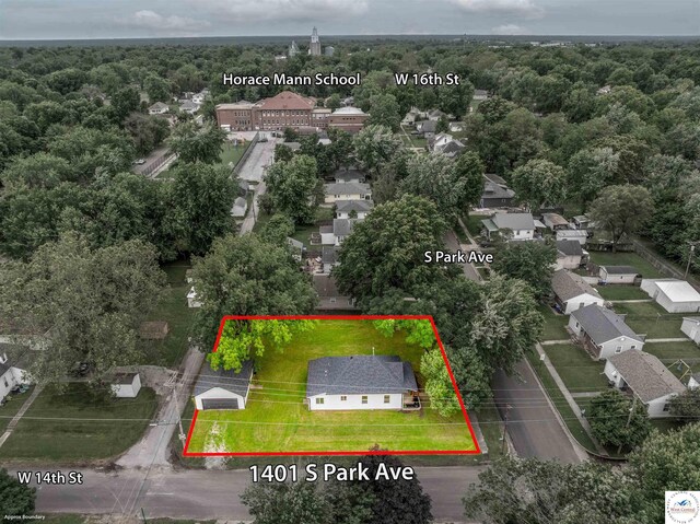 1401 S Park Ave, Sedalia, MO 65301 - aerial perspective of suburban area with a forest and property boundaries highlighted