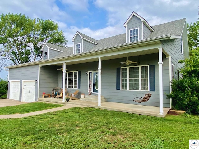 165 NE 100th Rd, Clinton, MO 64735 - cape cod-style house featuring a porch, a front yard, and ceiling fan