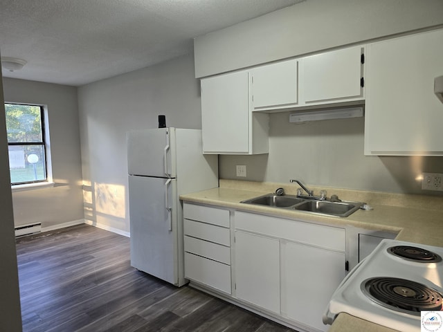 206 N Ohio St, Chilhowee, MO 64733 - kitchen with a sink, light countertops, dark wood-style floors, baseboard heating, and white appliances