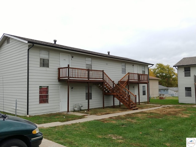 206 N Ohio St, Chilhowee, MO 64733 - back of house featuring a lawn, stairs, and a wooden deck