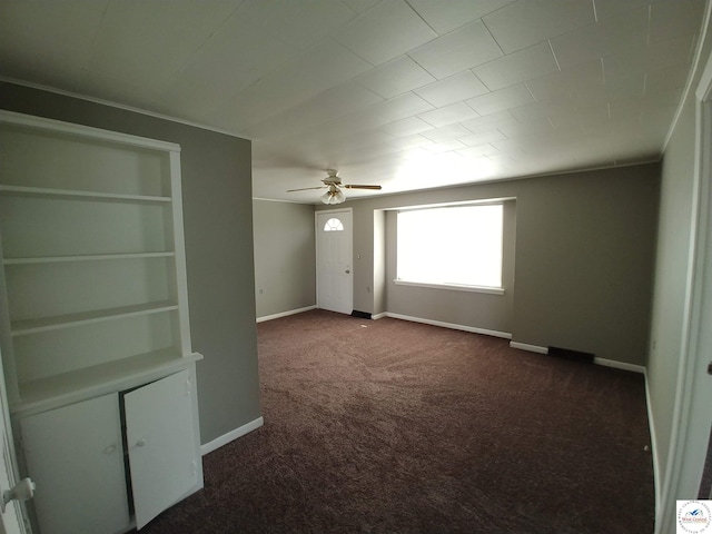 206 N Ohio St, Chilhowee, MO 64733 - empty room with a ceiling fan, dark colored carpet, and baseboards