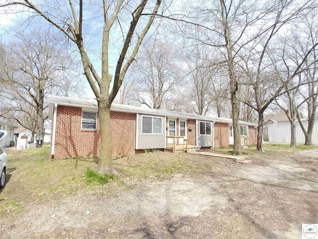 206 N Ohio St, Chilhowee, MO 64733 - single story home with fence and brick siding