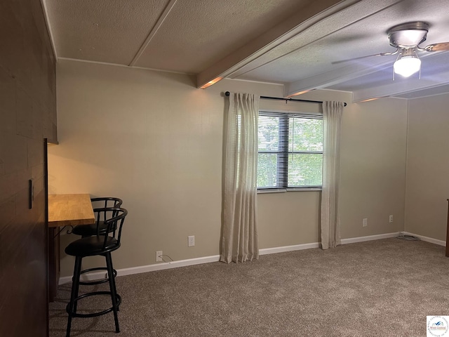 25609 Honey Bear Loop, Warsaw, MO 65355 - empty room featuring beamed ceiling, carpet floors, a textured ceiling, and a ceiling fan