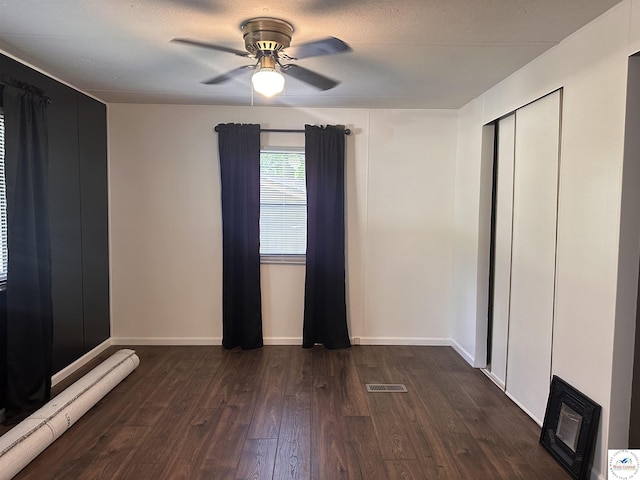 25609 Honey Bear Loop, Warsaw, MO 65355 - unfurnished bedroom with dark wood-style floors, ceiling fan, and a closet