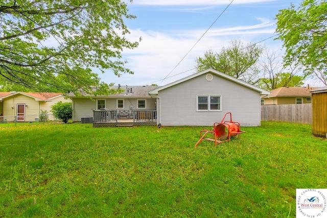 904 Leone Ave, Sedalia, MO 65301 - rear view of house featuring a yard, a deck, and fence