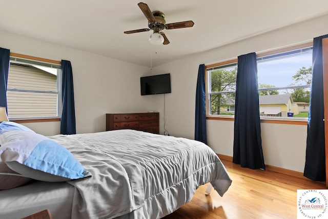 904 Leone Ave, Sedalia, MO 65301 - bedroom featuring a ceiling fan and wood finished floors