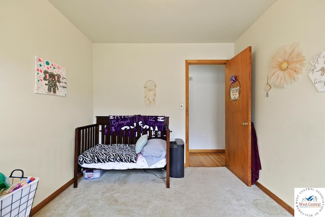 904 Leone Ave, Sedalia, MO 65301 - carpeted bedroom featuring baseboards