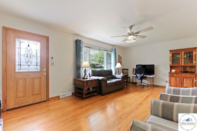 904 Leone Ave, Sedalia, MO 65301 - living room with light wood-type flooring, visible vents, baseboards, and a ceiling fan