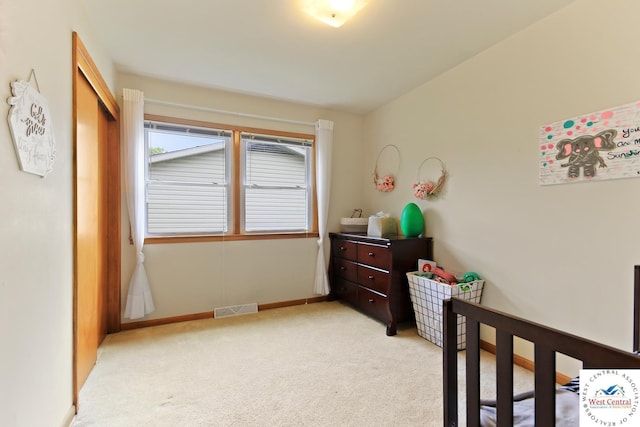 904 Leone Ave, Sedalia, MO 65301 - bedroom featuring light carpet, baseboards, and visible vents