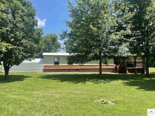 17254 Walnut Rd, Warsaw, MO 65355 - view of green lawn with a wooden deck