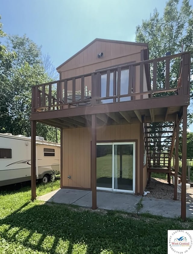 17254 Walnut Rd, Warsaw, MO 65355 - rear view of property featuring a wooden deck