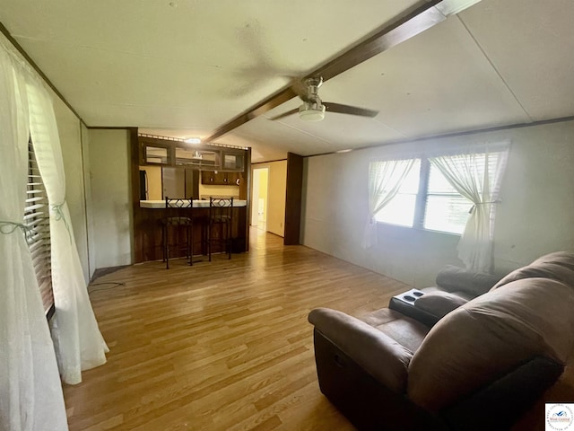 17254 Walnut Rd, Warsaw, MO 65355 - living room featuring light wood-style floors, a bar, and ceiling fan