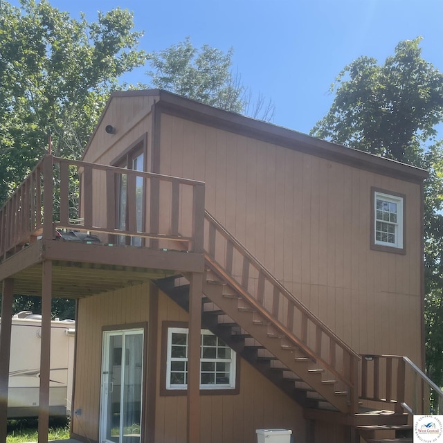 17254 Walnut Rd, Warsaw, MO 65355 - rear view of property featuring stairs and a wooden deck