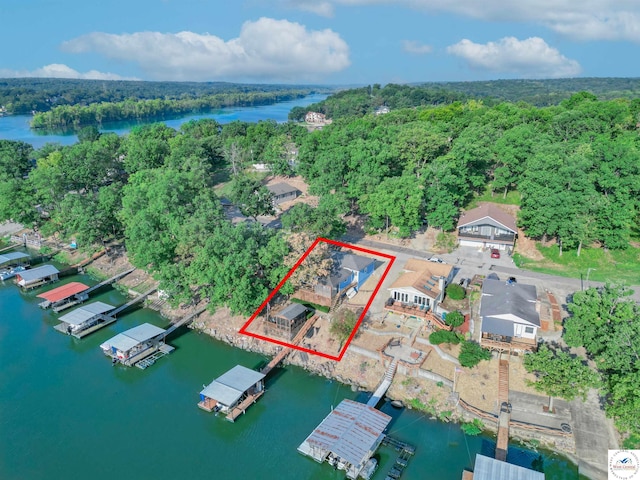 28174 Apex Ave, Warsaw, MO 65355 - aerial view of property's location with a large body of water, property parcel outlined, and a forest